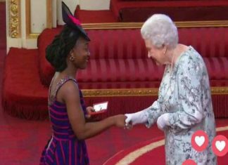 KUMBA MUSA RECEIVING AN AWARD FROM QUEEN ELIZABETH II AS A YOUNG LEADER KUMBA MUSA RECEIVING AN AWARD FROM QUEEN ELIZABETH II AS A YOUNG LEADER